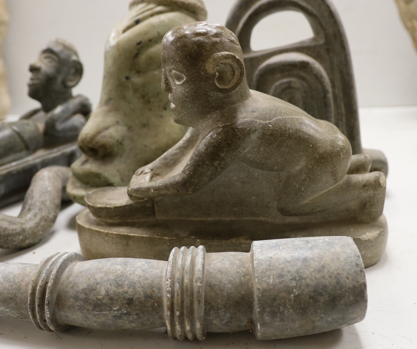 Eight Shona stone carvings, 1960s-70s including a kneeling figure and sleeping figure,both signed D.S. Dube, other figures, heads and abstract sculpture forms, tallest 35cm
